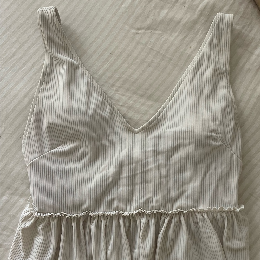 Kortni Jeane small white ribbed V Neck peplum swim top